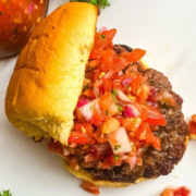 grilled burger with a relish made from fresh tomatoes