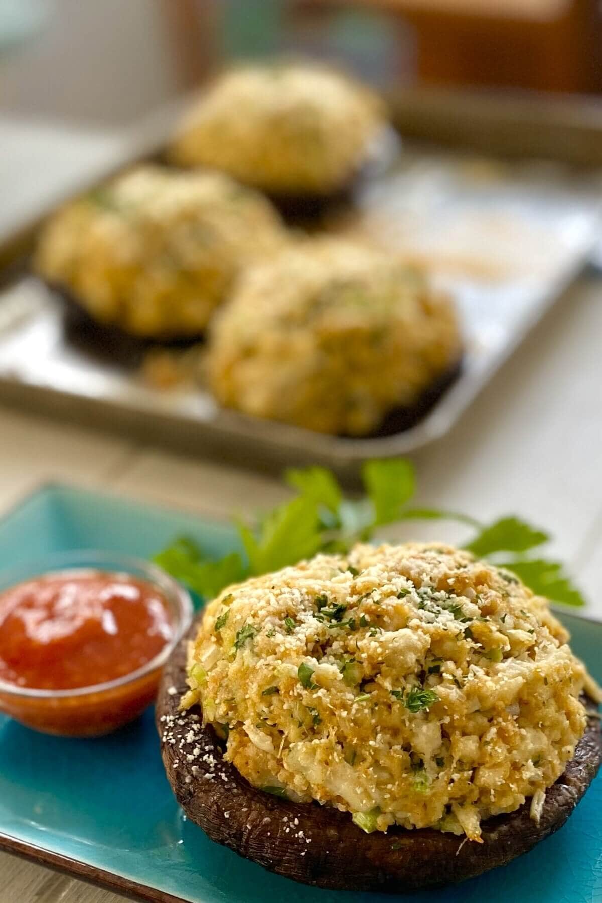 crab stuffed portobello with sauce.