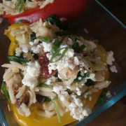 A stuffed pepper with orzo and feta.