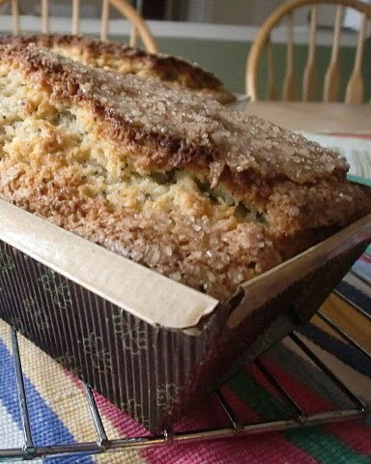 A sugar-topped loaf of poppy seed bread.