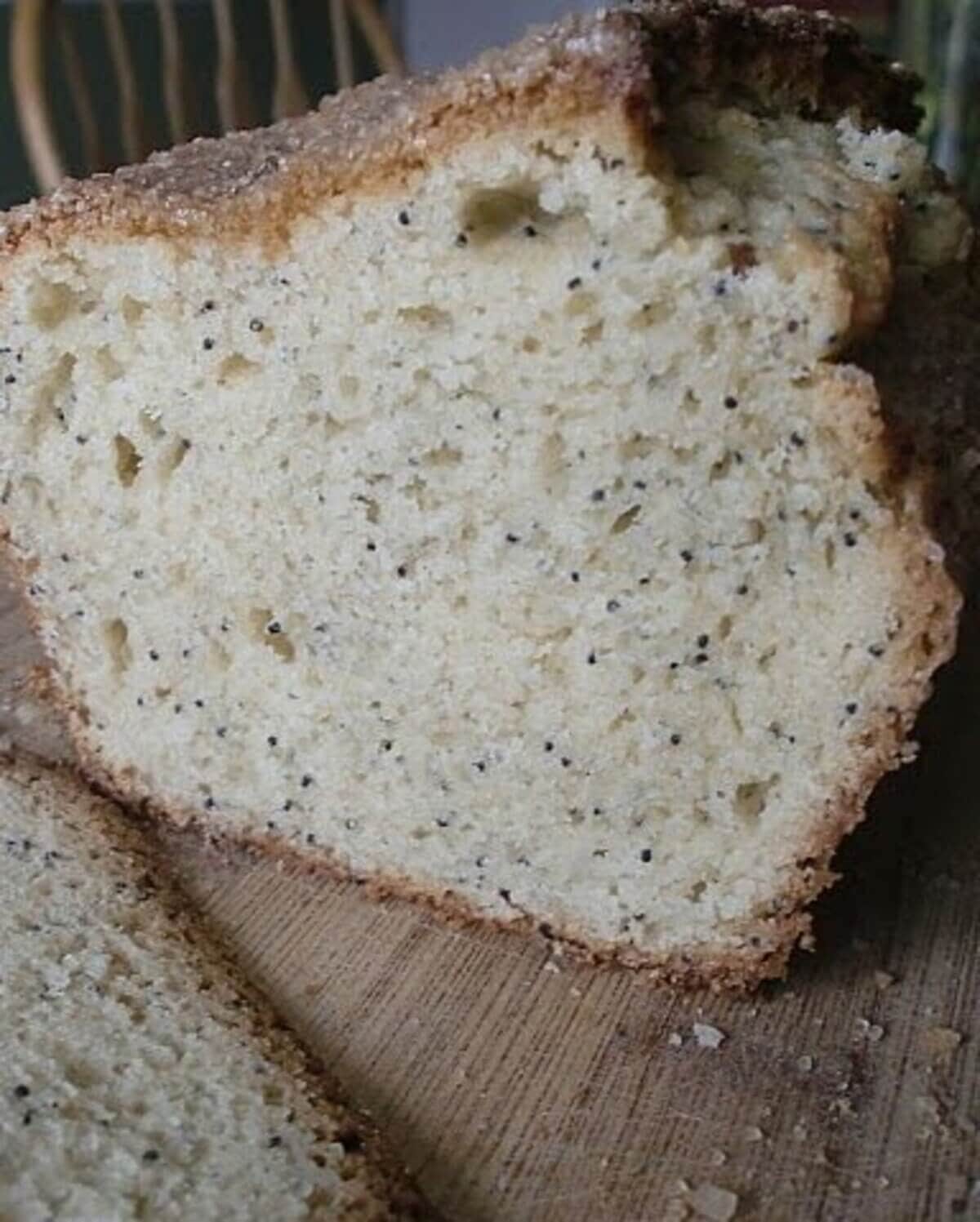 A sliced loaf of poppy seed bread.