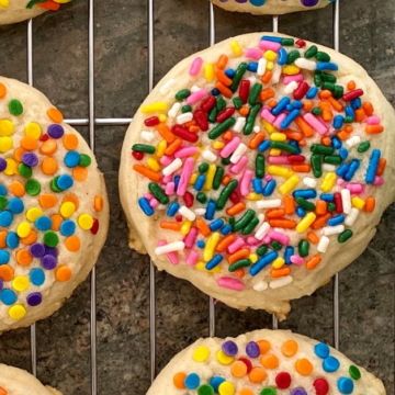sugar cookies with sprinkles on a cooling rack
