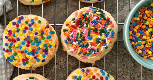 sugar cookies with sprinkles on a cooling rack