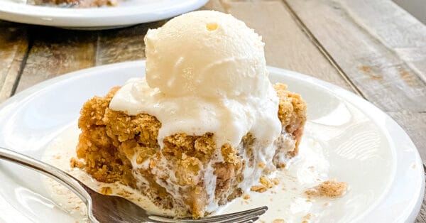 slice of apple crumb bar with vanilla ice cream