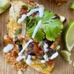 A wedge of a tortilla stack with limes.