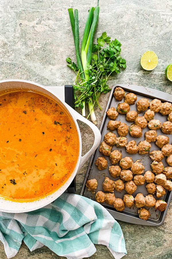 baked meatballs and a red curry sauce