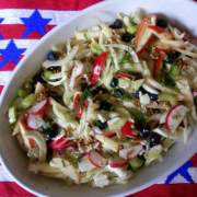 A serving dish with raw fennel and apple salad.