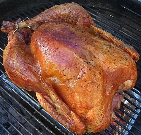 golden brown and crispy grilled turkey on a grill rack