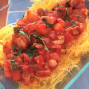A vegetable bolognese served over spaghetti squash.