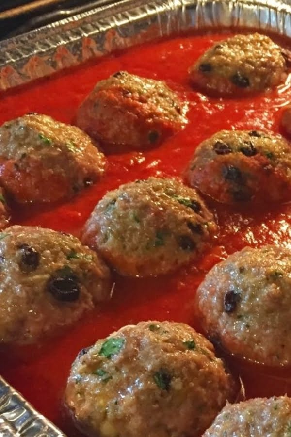 meatballs baking in tomato sauce
