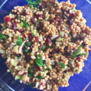 A bowl of couscous with cranberries.