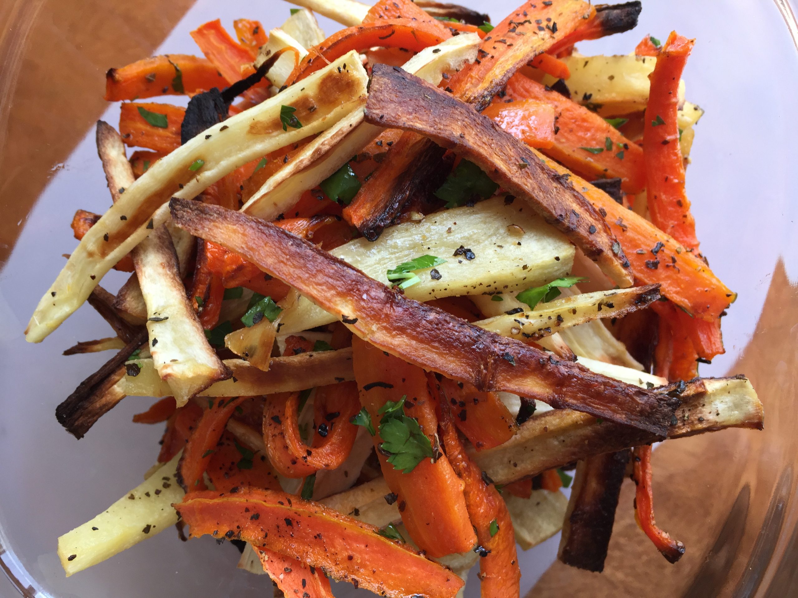 a plate of crispy carrot and parsnip fries