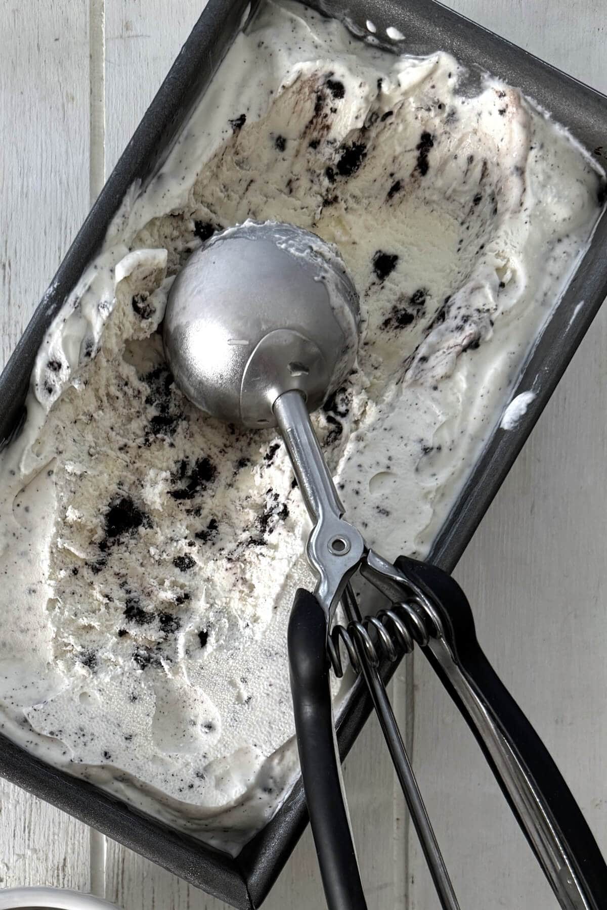 A metal loaf pan with no churn ice cream.
