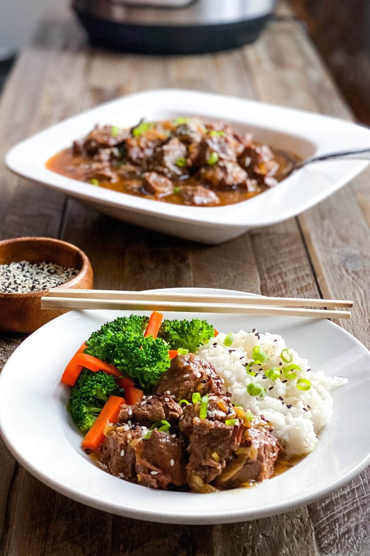 bowl of beef stew and serving bowl