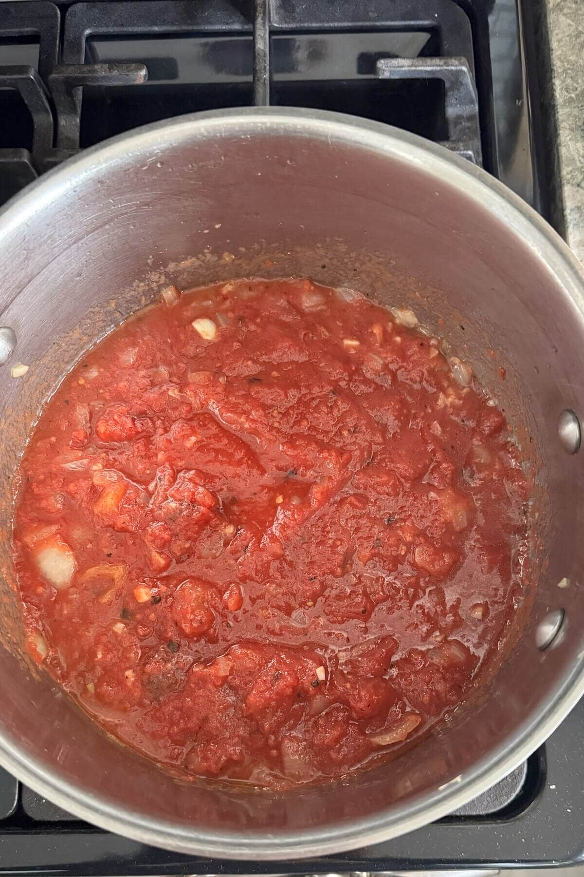 Marinara sauce in a pot for mussels in red sauce.