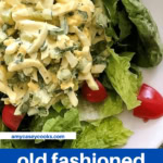 chunky egg salad with tomatoes over lettuce