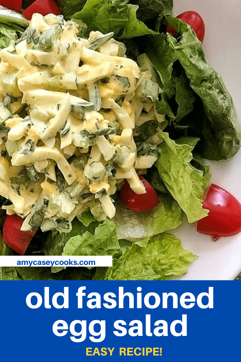 chunky egg salad with tomatoes over lettuce