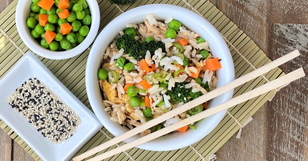 bowl of fried rice with chicken and broccoli