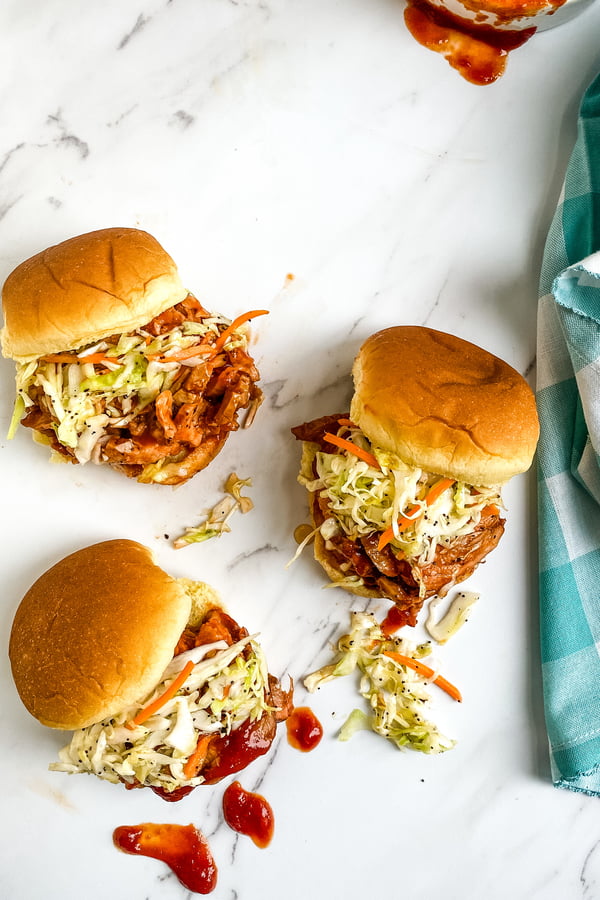small sandwiches with barbecue sauce and cole slaw