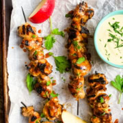 chicken on skewers with a honey mustard dipping sauce