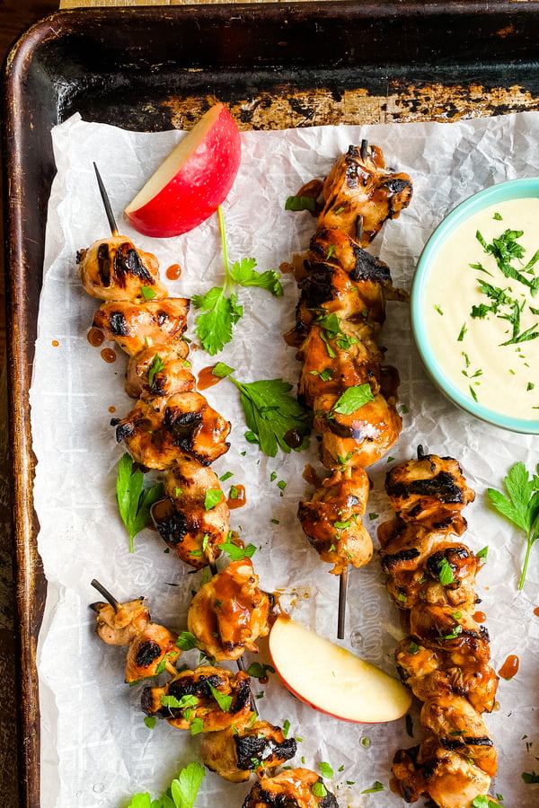 chicken on skewers with a honey mustard dipping sauce