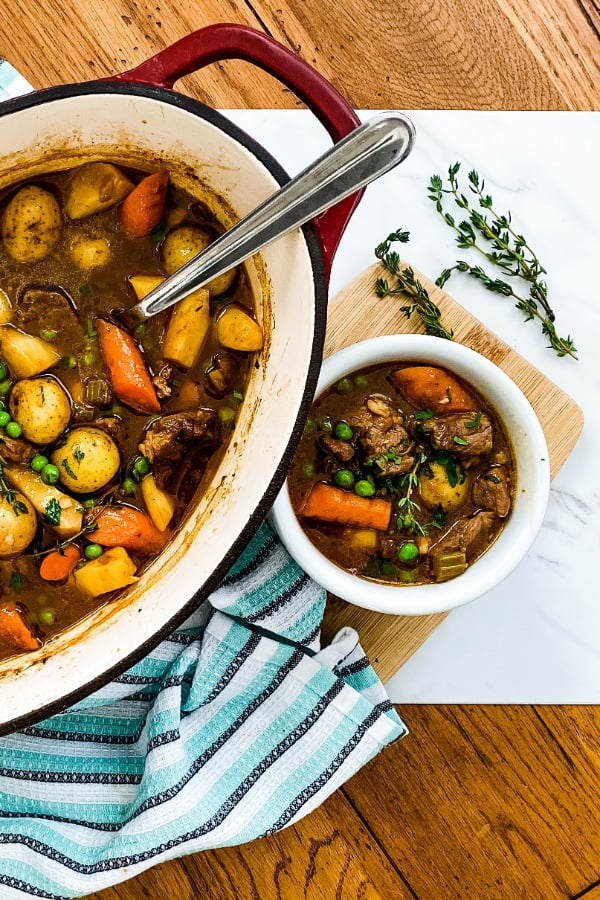 dutch oven and bowl of lamb stew
