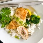 stuffed chicken breasts with rice and broccoli.