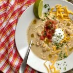 bowl of green enchilada chicken soup made in Instant Pot