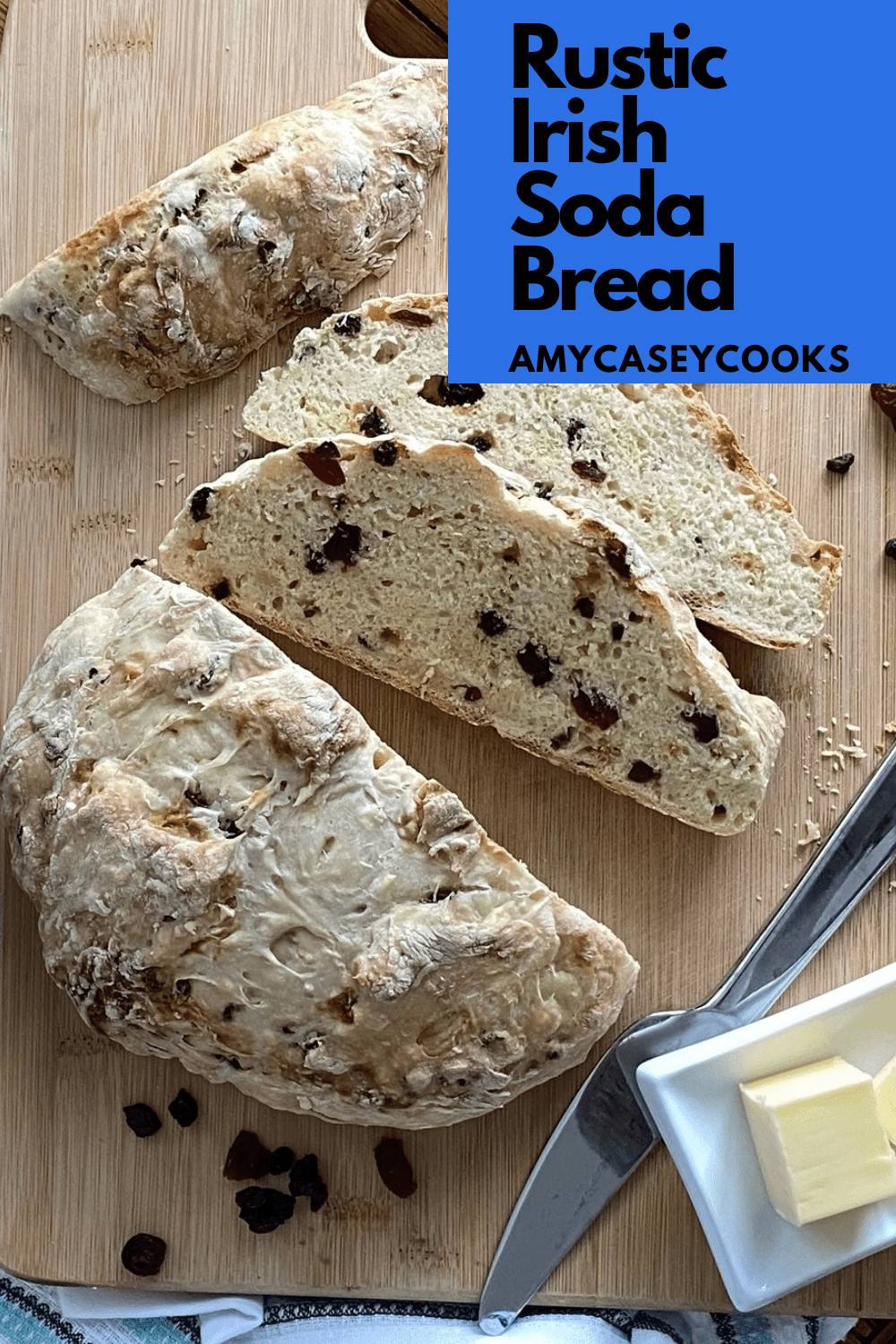 Irish soda bread with 2 slices on a board.