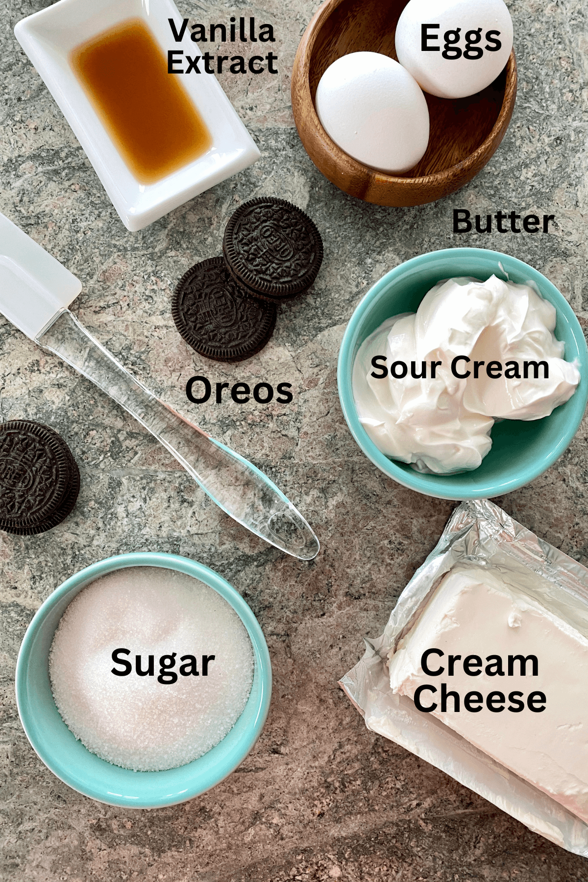 Cream cheese, Oreos, sour cream, sugar, vanilla and eggs for a cheesecake.