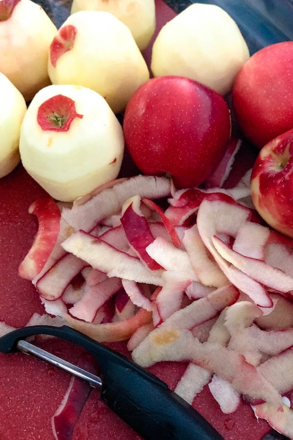 apples and apple peels with a peeler