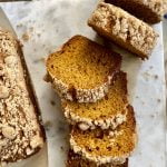 a loaf of pumpkin bread with streusel topping sliced