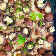 pan of baked mushrooms with butter, garlic and blue cheese