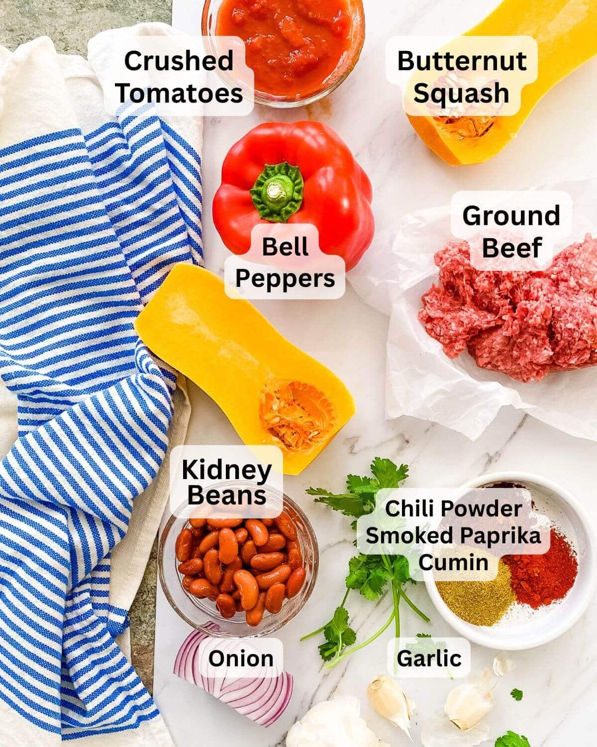 Ingredients needed to make ground beef and butternut squash chili.