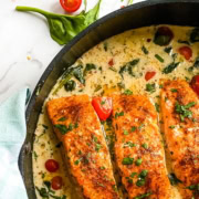 skillet with baked salmon in a coconut sauce - personal chef recipe
