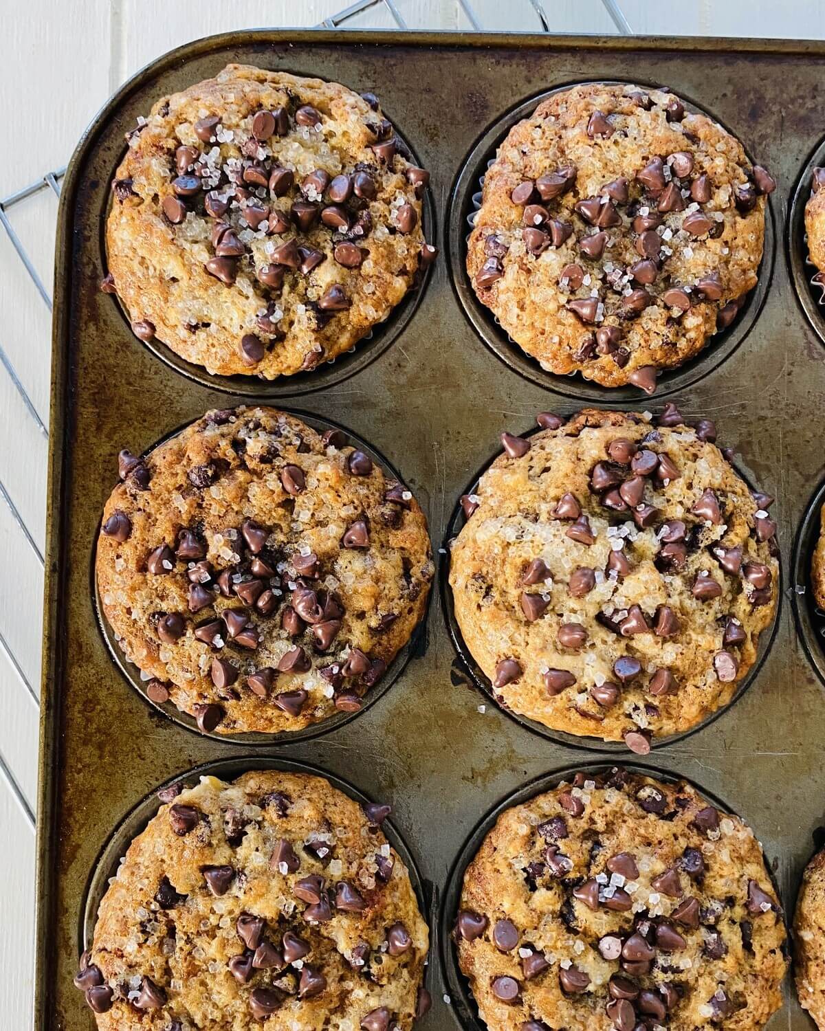 6 baked banana muffins in a pan.