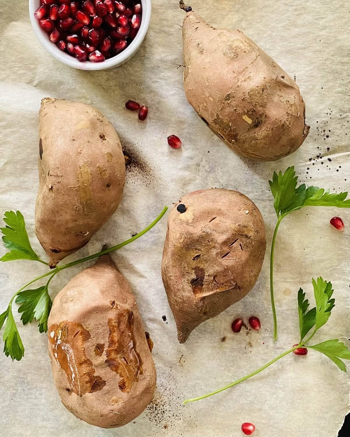 Baked sweet potatoes on parchment paper.