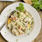 white bowl with turkey a la king and a fork.