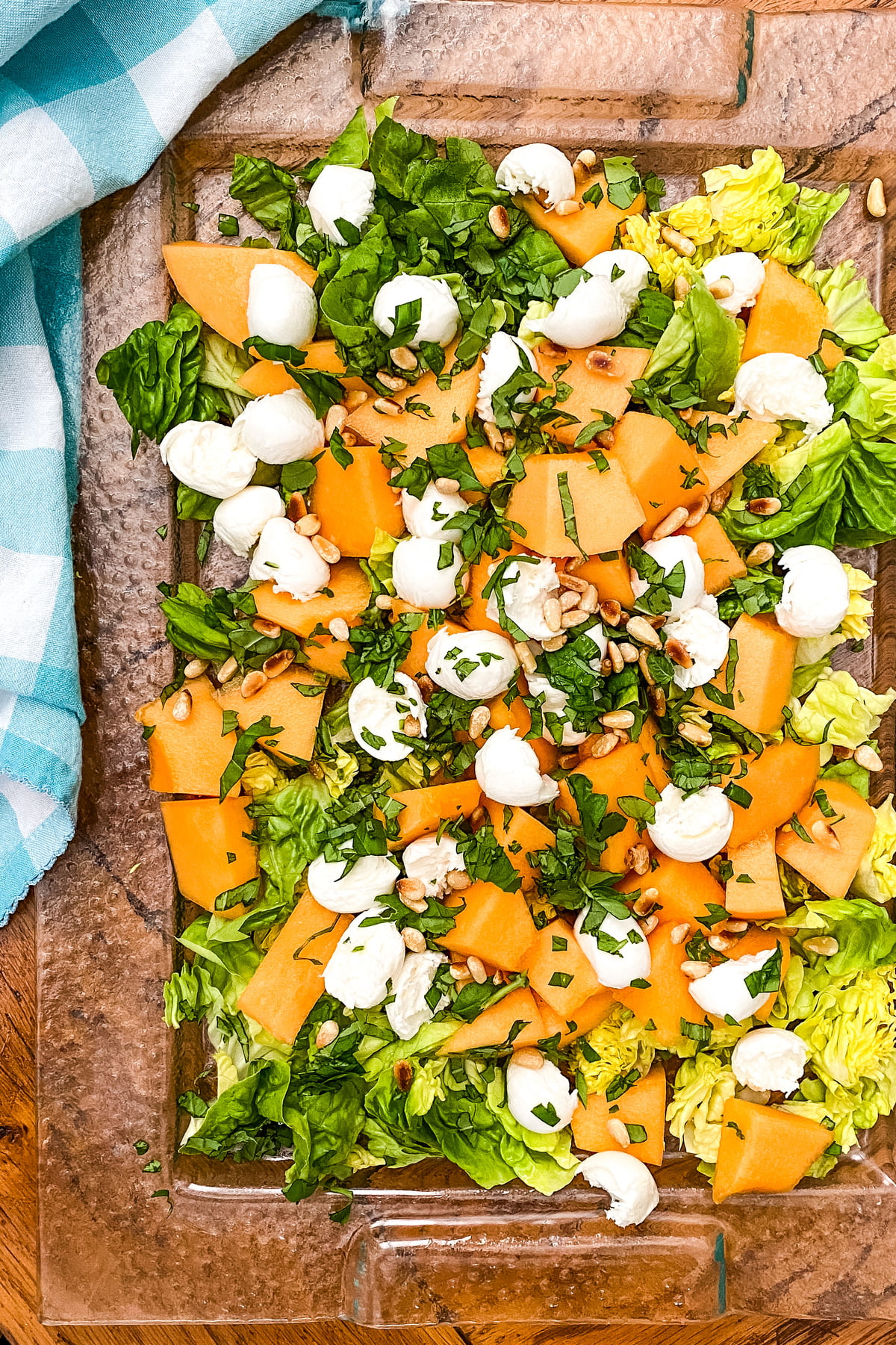 summer cantaloupe with fresh mozzarella and pine nuts