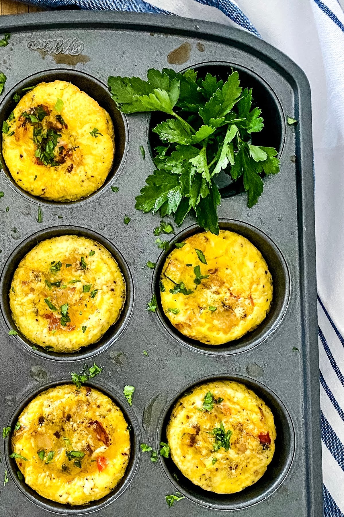 muffin tin with baked eggs