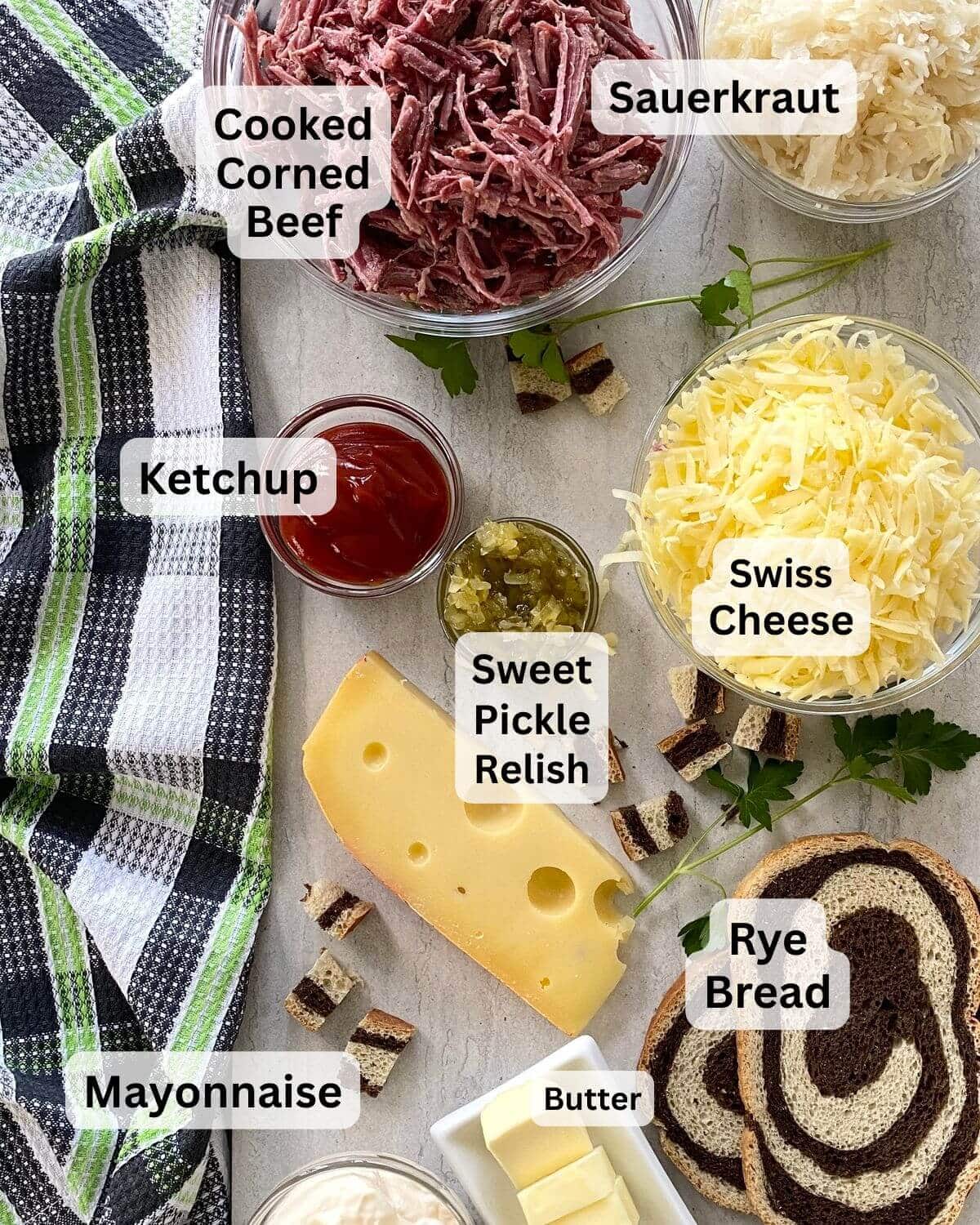Cooked corned beef, sauerkraut, marble rye bread, shredded Swiss cheese, ketchup, relish, mayonnaise.