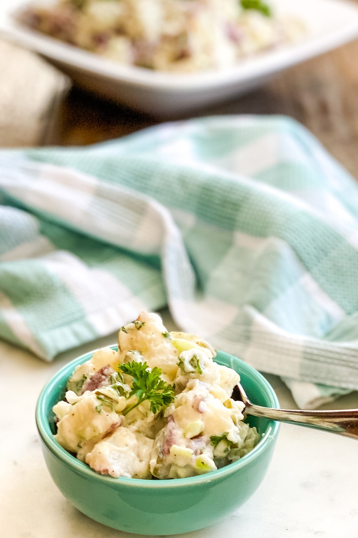 a small bowl of creamy potato salad 