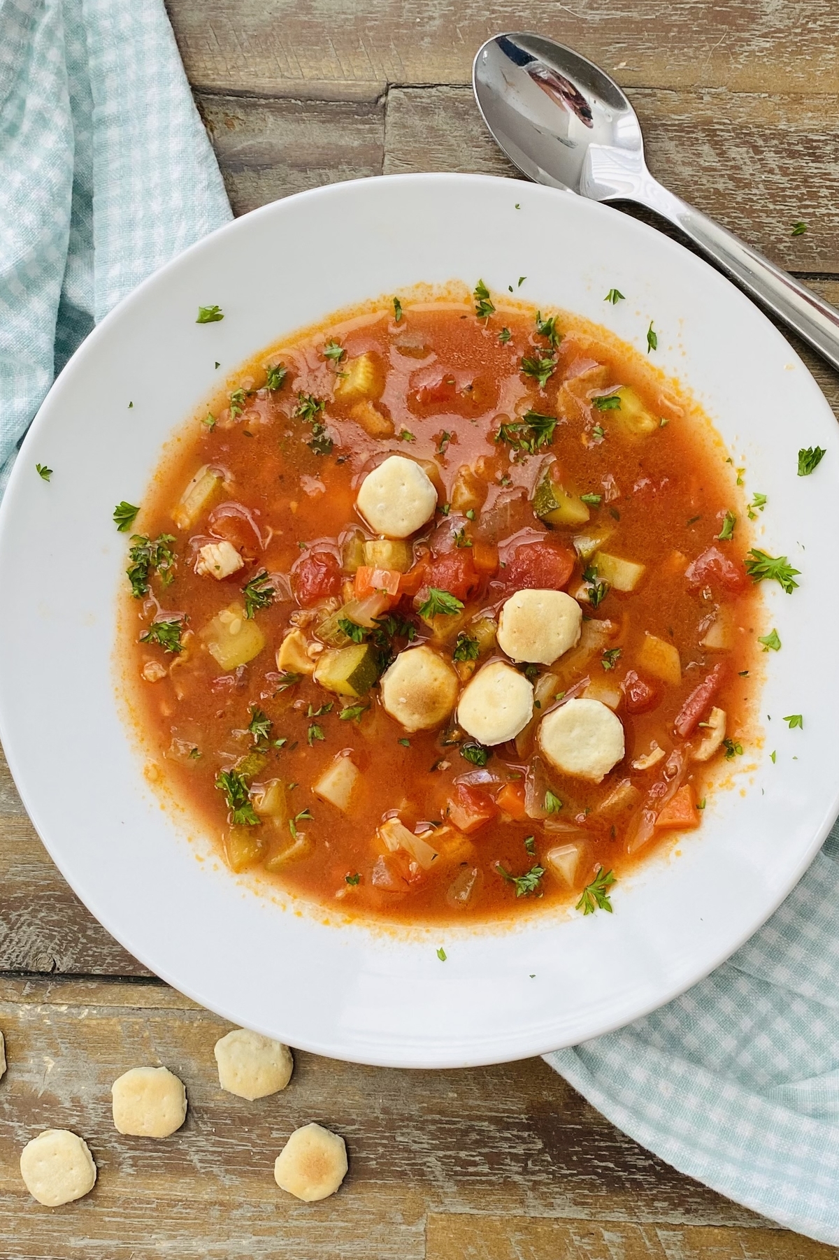 Manhattan clam chowder recipe in a bowl with oyster crackers