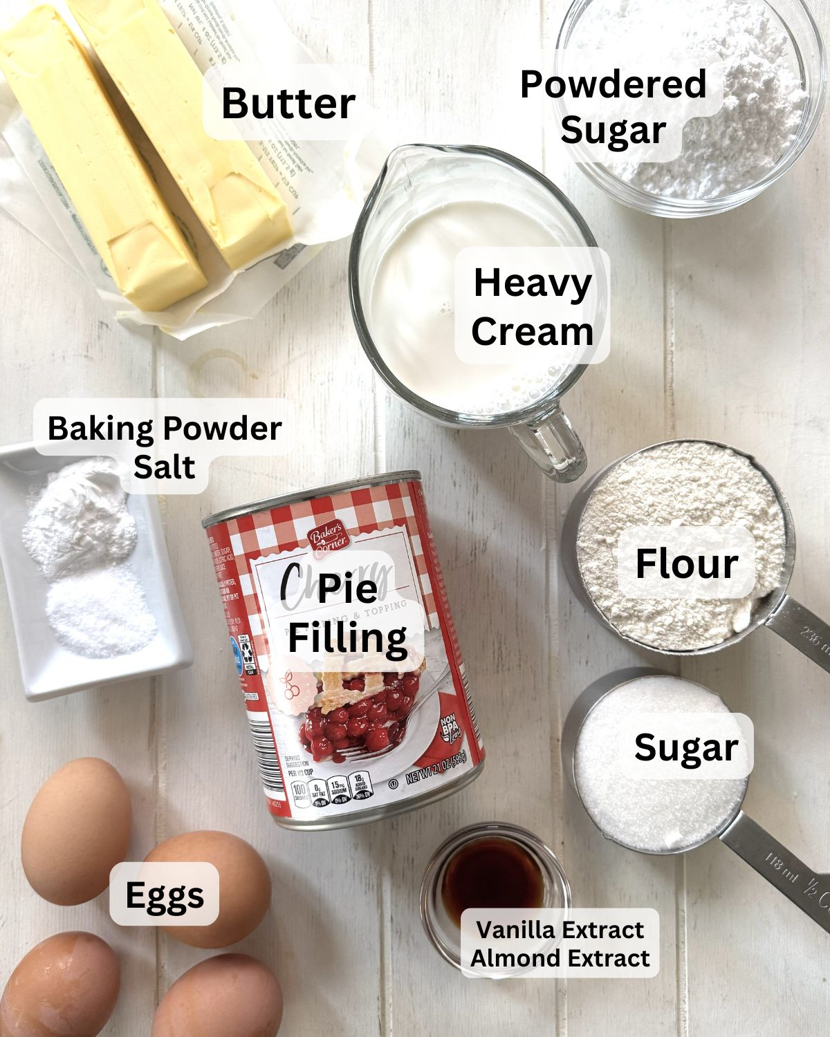 Butter, flour, eggs, pie filling, baking powder, salt, sugar, heavy cream for a scone cake.