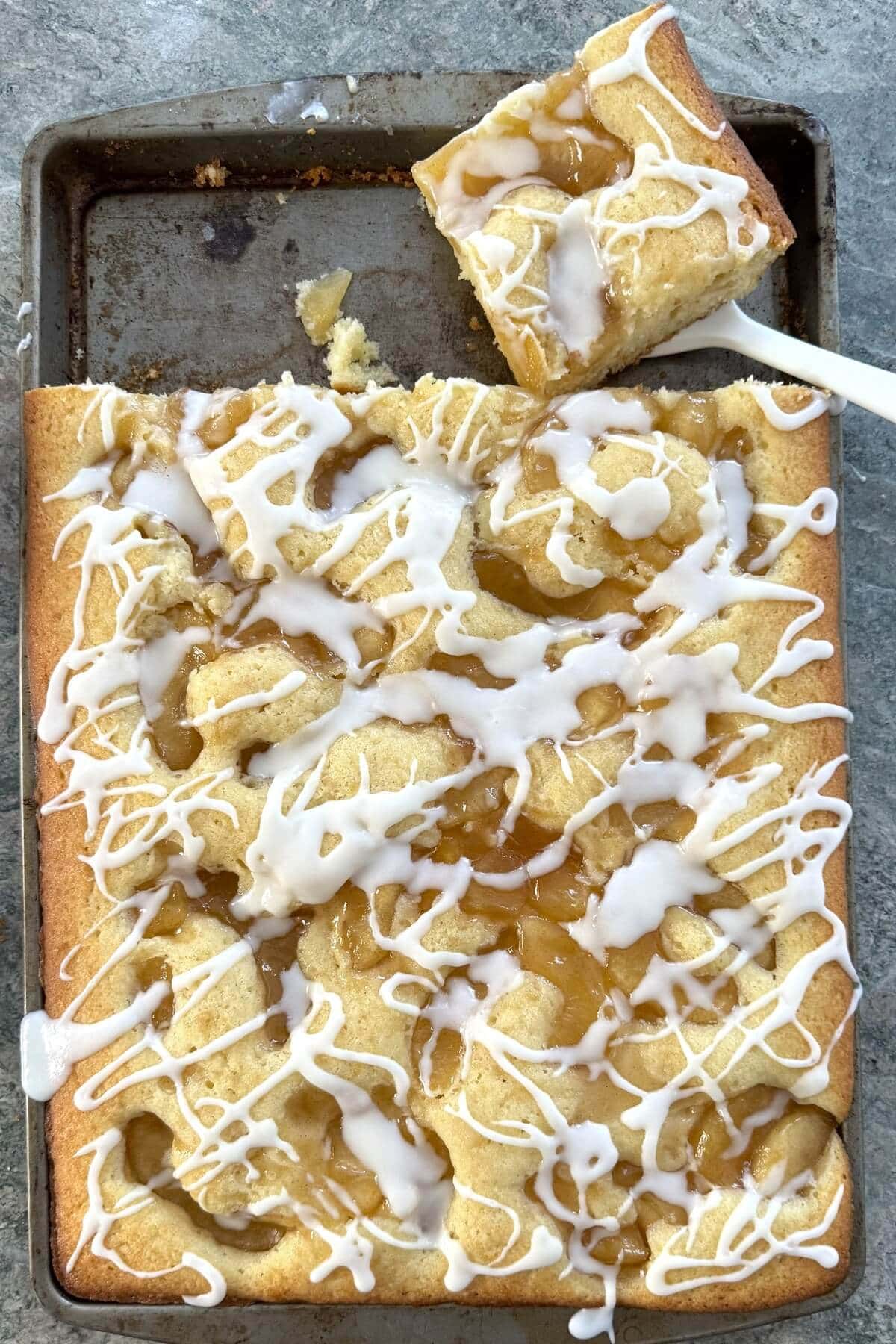 A large scone cake in a jelly roll pan.