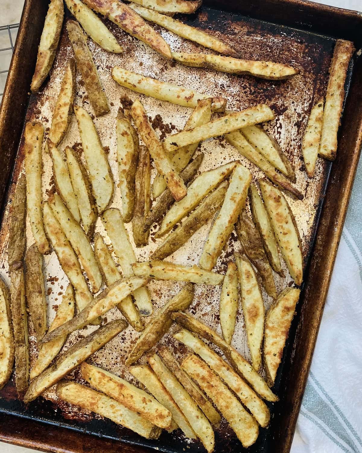 Baking sheet with oven French fries.