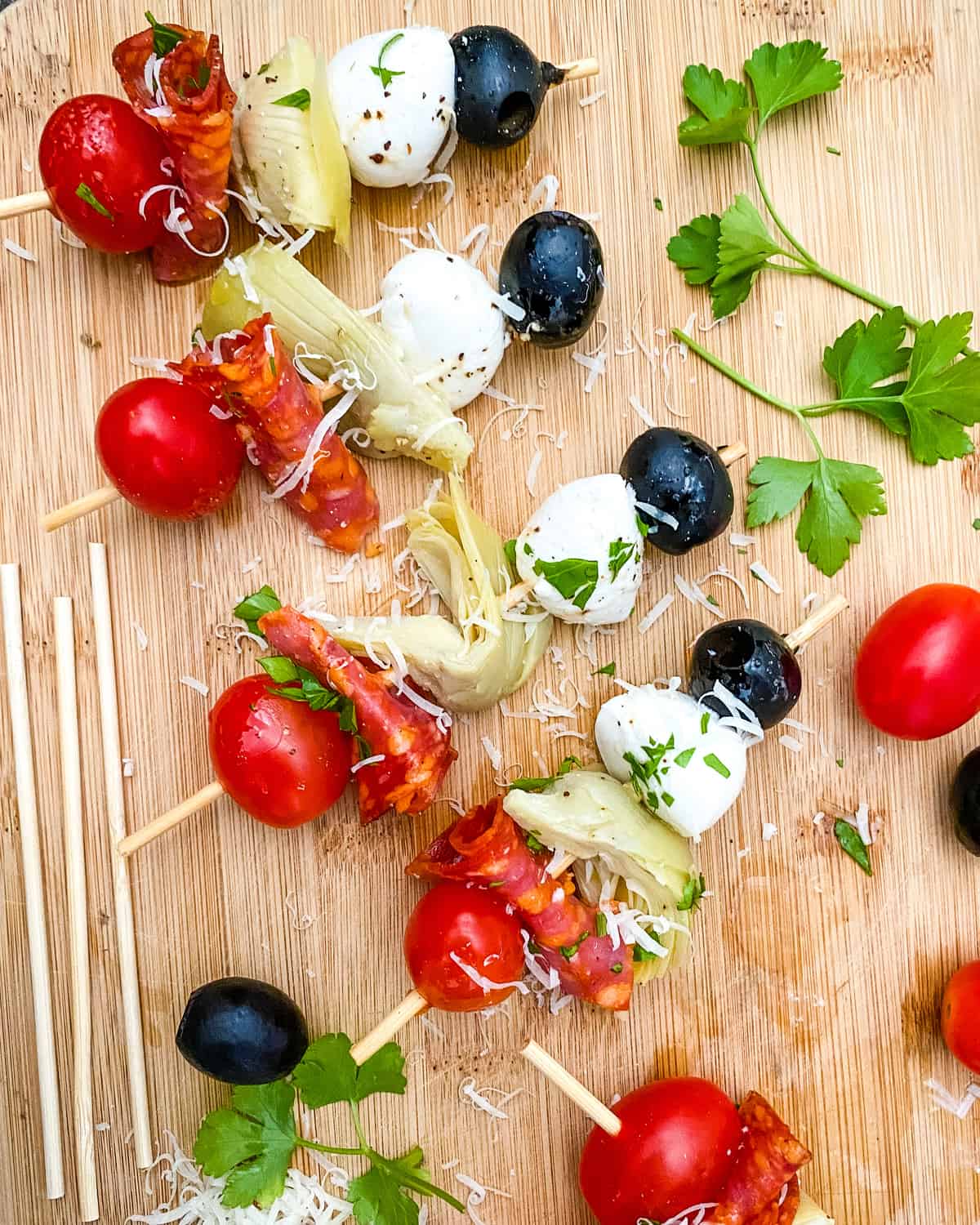 skewers with mozzarella, artichoke hearts, olives and salami