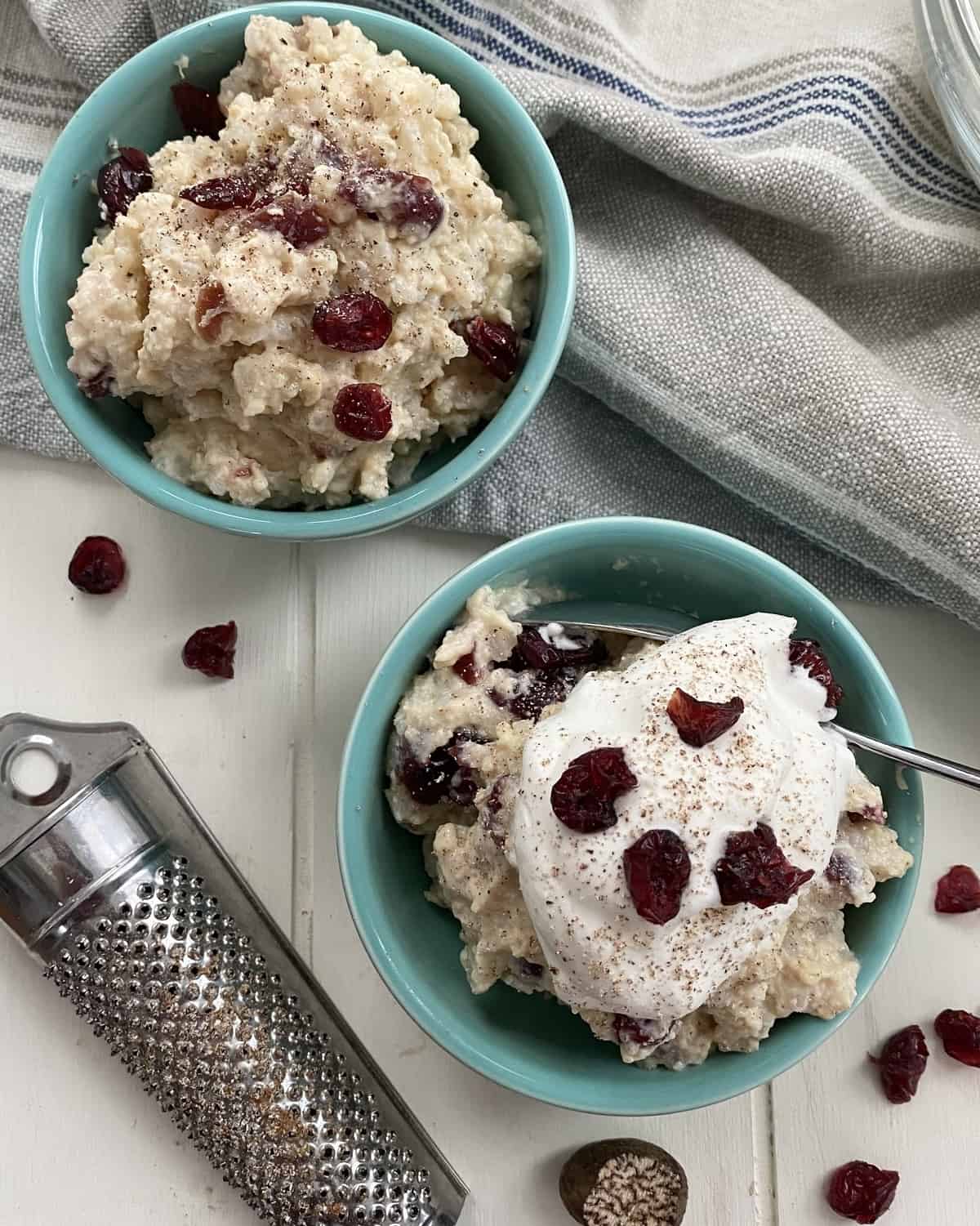 2 bowls of rice pudding with dried cranberries