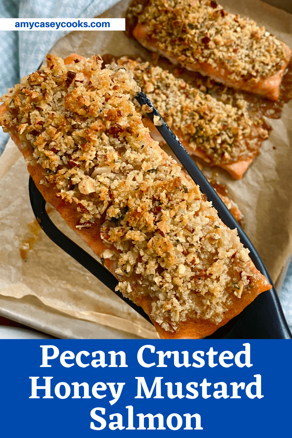 Some pecan crusted honey mustard salmon on a spatula.
