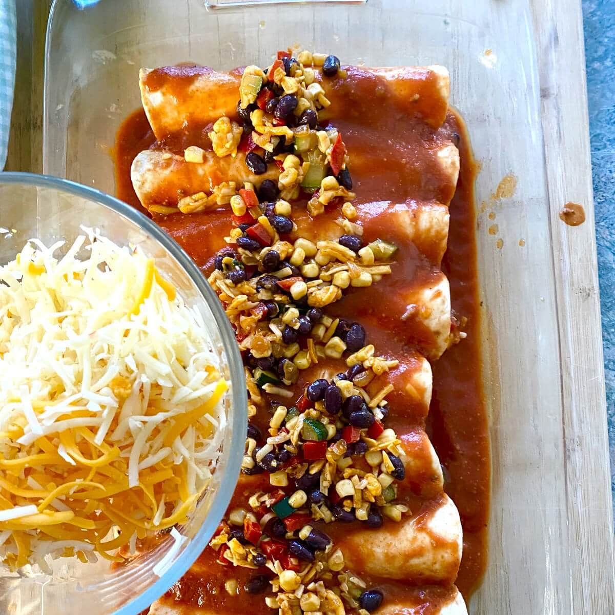 Shredded cheese and enchiladas.